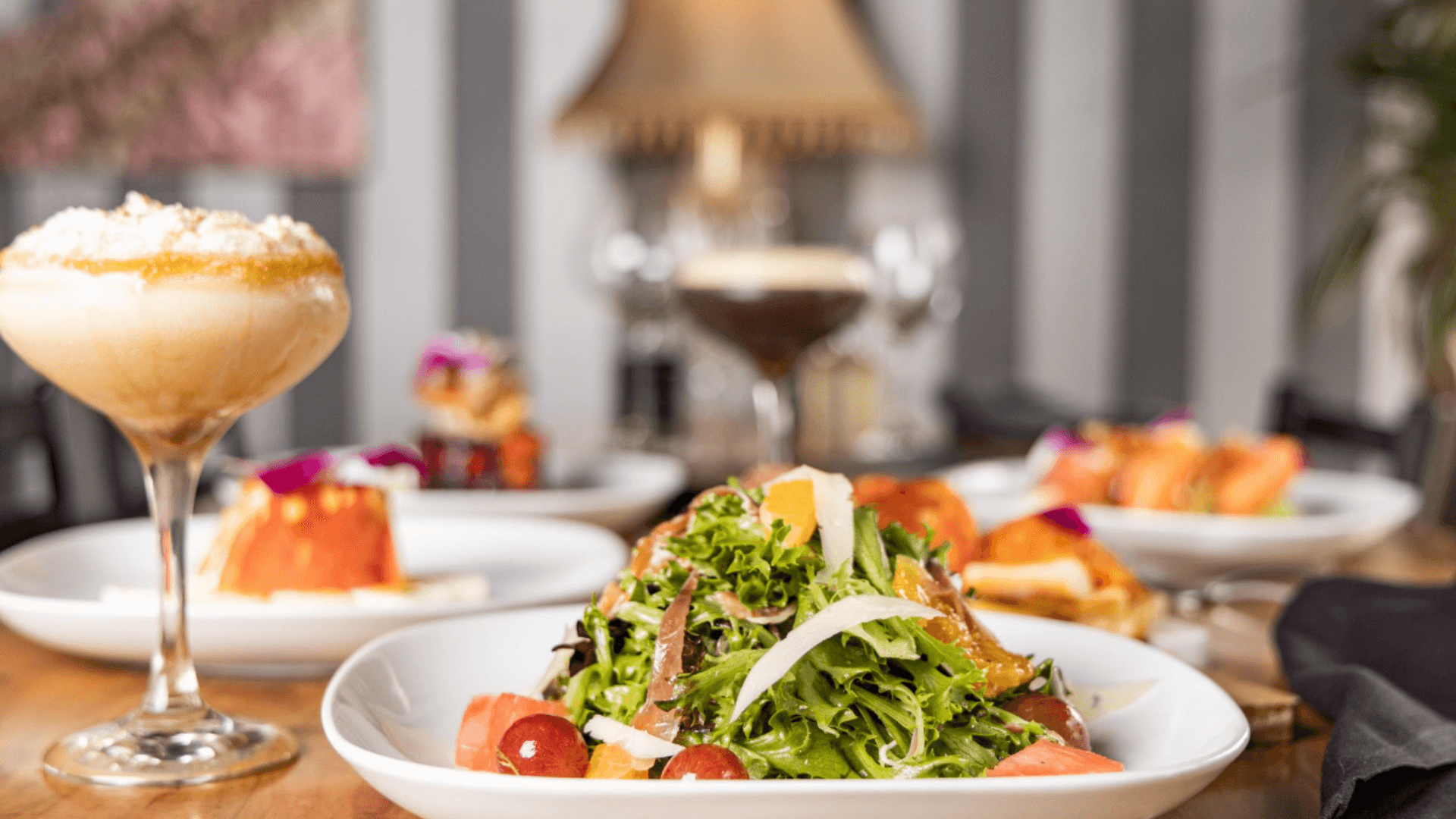 Tapas spread with cocktails and fresh salad at The Manhattan