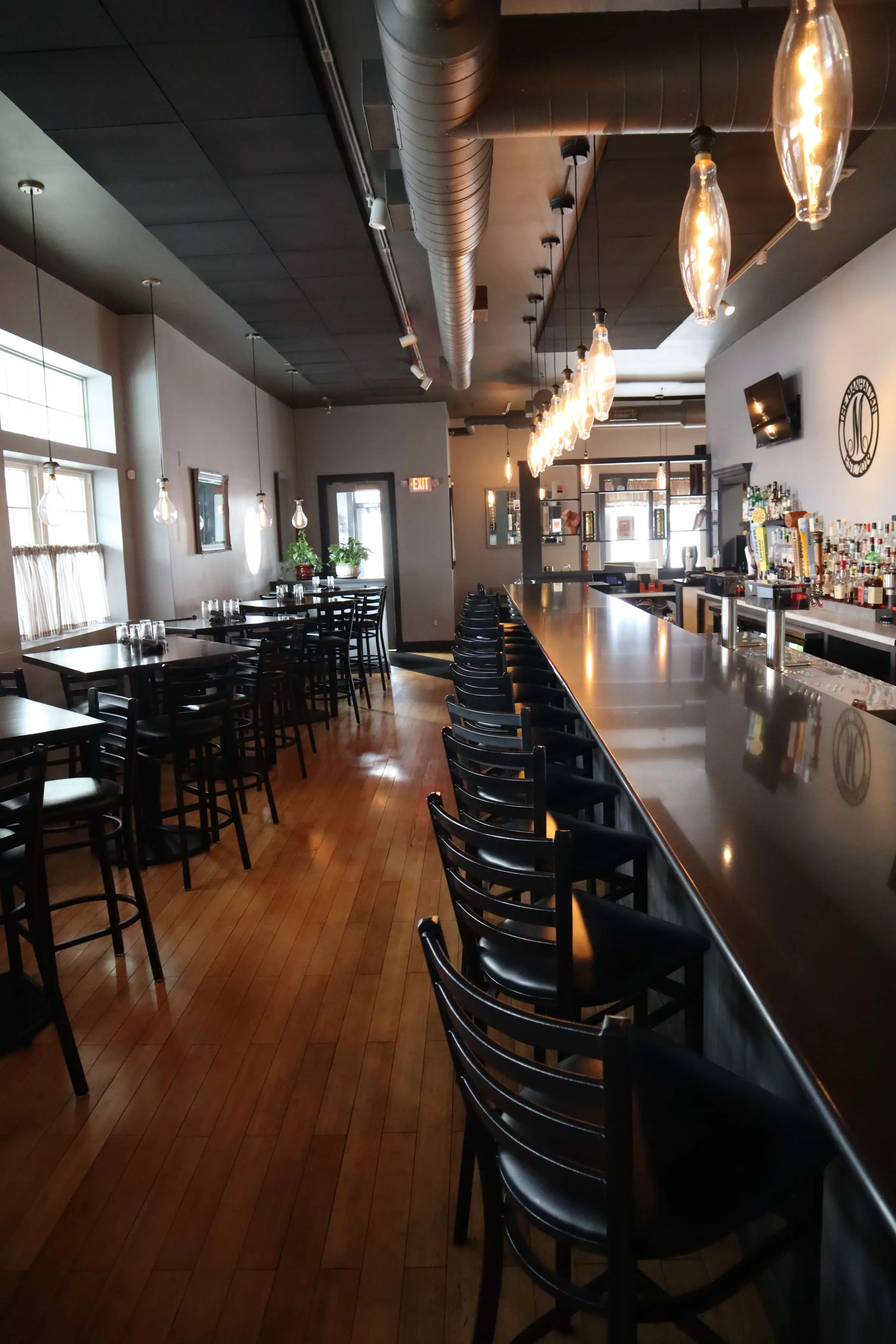 The Manhattan bar seating and dining area