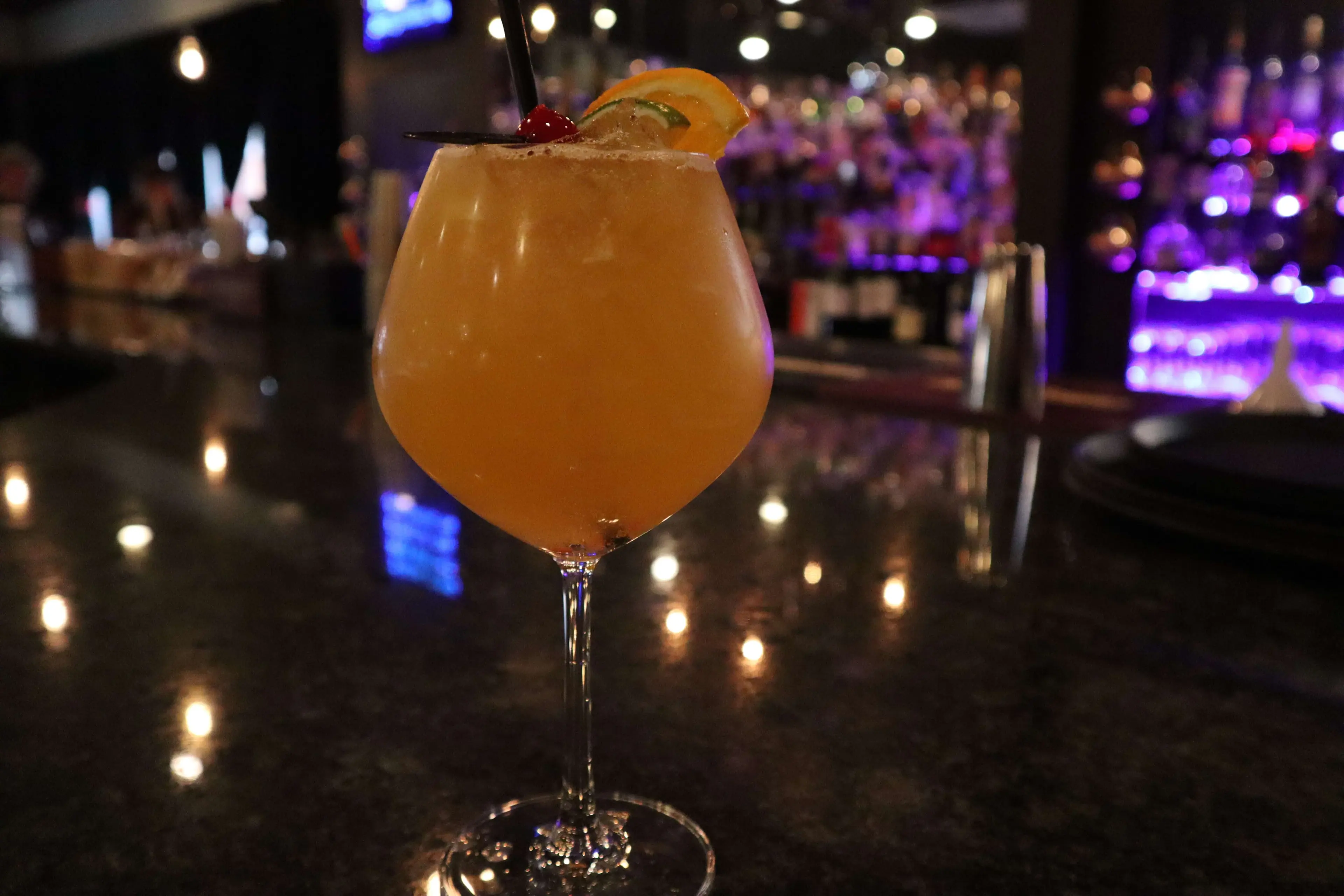 Craft cocktail with orange garnish